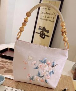 Embroidered shoulder back handbag